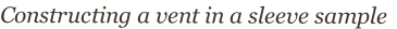 Constructing a vent in a sleeve sample
