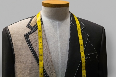 learn to sew the technique of real bespoke tailoring. An image of a tailored jacket dispalyed on a mannequin