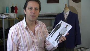Your host at the sewng guru, michael coates is stood holding a commercial sewing pattern